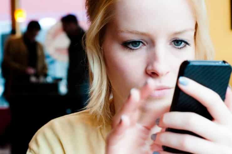 young-woman-using-a-mobile-phone-pic-getty-images-580339023